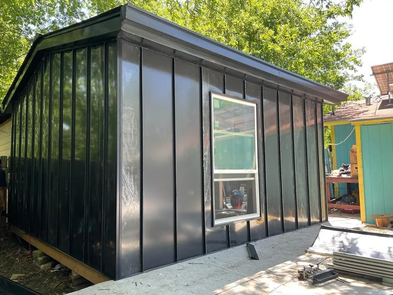 Black standing seam metal wall panels for Roof Inspection in Fairview