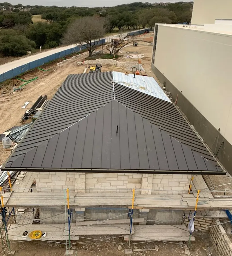Metal roof new construction with scaffolding in Fairview